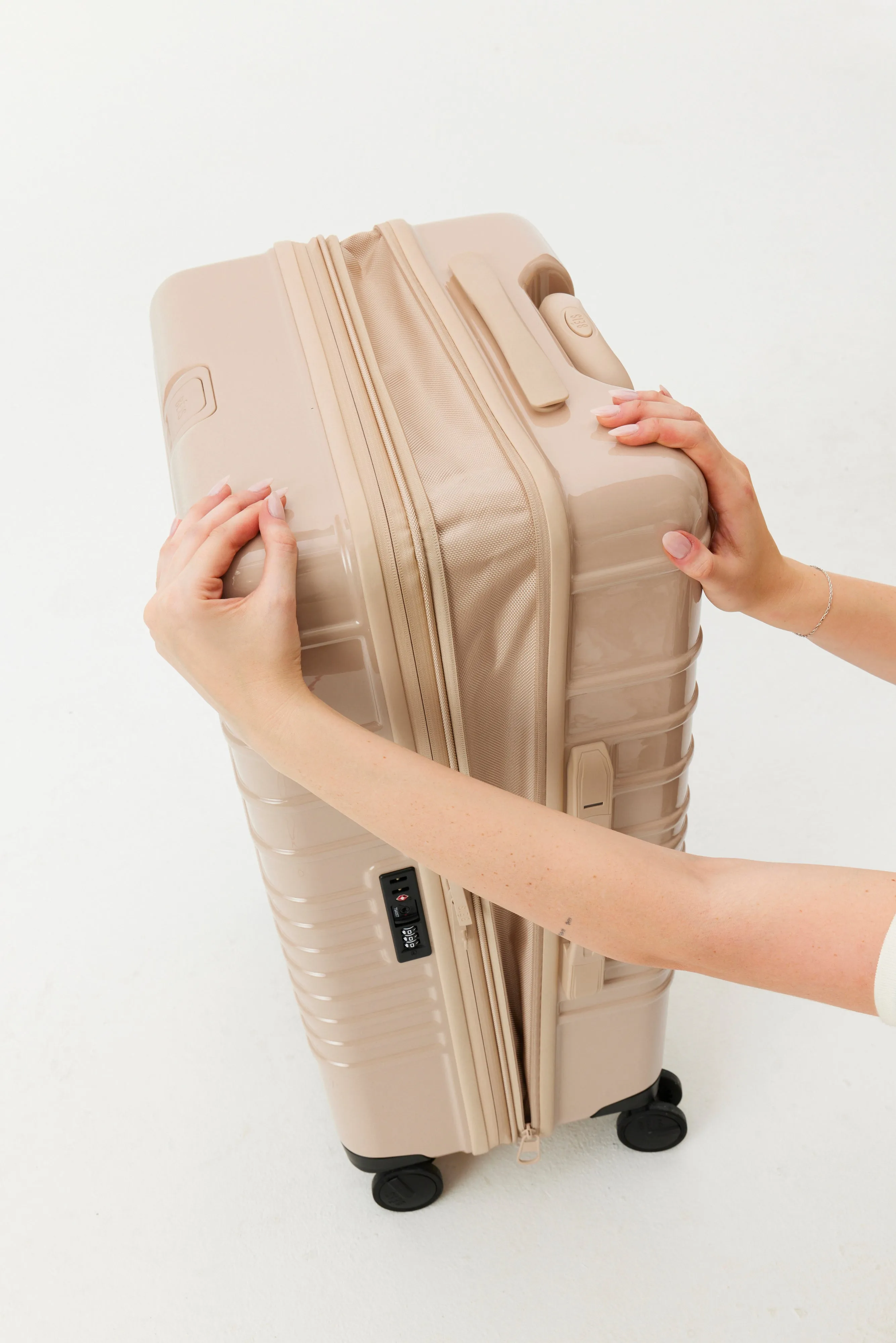 The Medium Check-In Roller in Glossy Beige